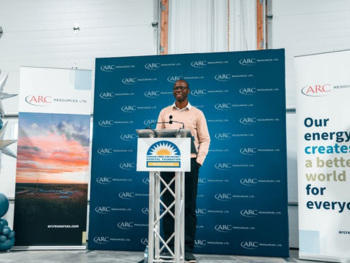 Man stands at podium 