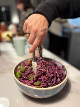 A bowl of red cabbage slaw.