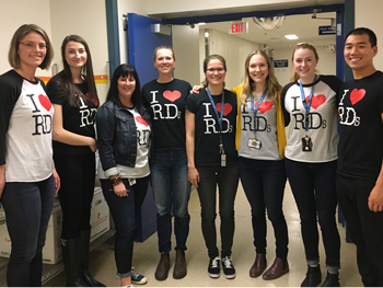 Eight dietitians pose in I heart RD tshirts.