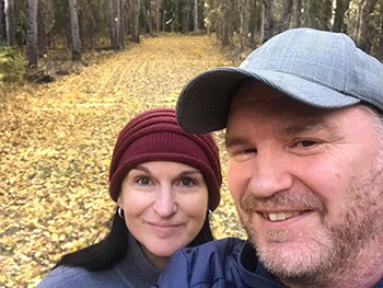 man and woman in fall landscape