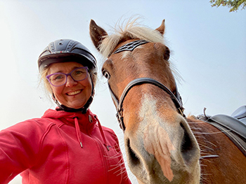 Woman and horse up close