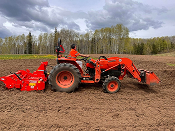 Tractor plowing the field. 