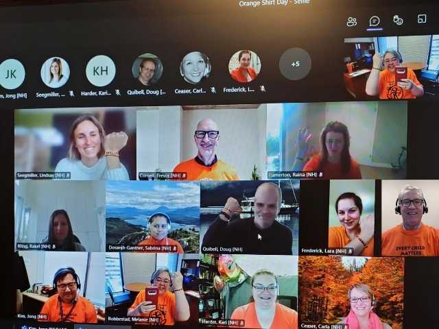 group of people wearing orange shirts on a zoom meeting