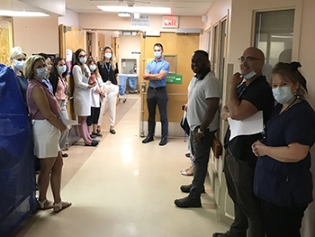 Group of hospital staff standing in the hallway