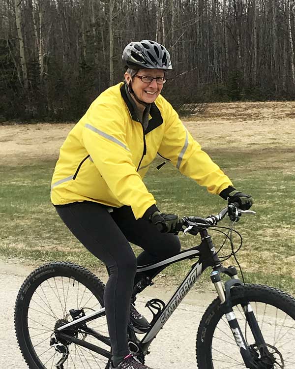 A woman riding a bike.