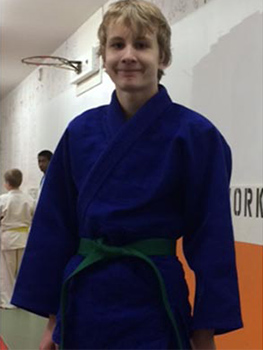Boy wearing jujitsu Gi