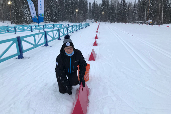 Cheryl Moors helping prep the finish area at the para nordic skiing championships.