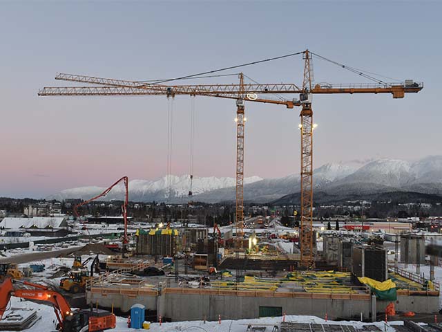 a large yellow crane on a construction site