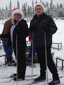 Man and woman skiing