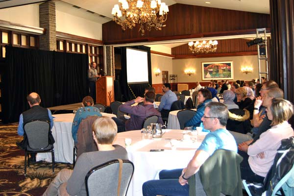 A group of people listening to a presentation.