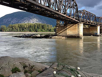 Preparing fish nets on the river in Northern BC