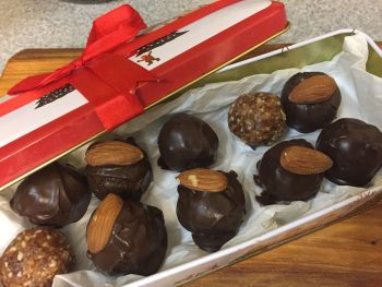 A box of homemade chocolate and nut balls