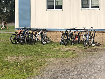 bikes lined up along a rack