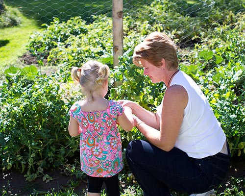 Woman and child in garden