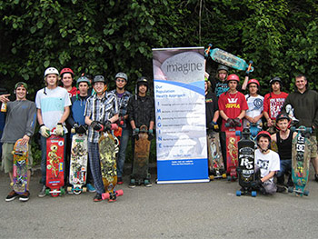 Group of longboarders with IMAGINE grants sign