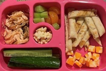 snack tray with a variety of cut up items for children