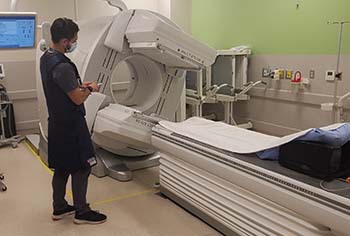 Smith demonstrates the SPECT-CT in action.