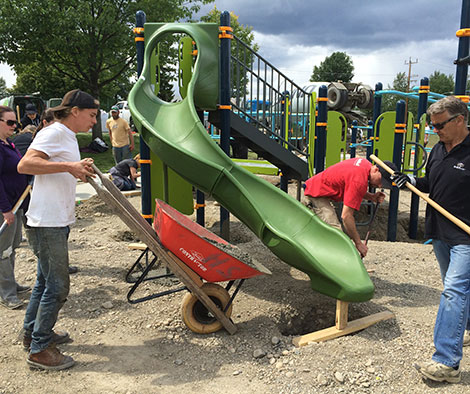 Volunteers assembling playground