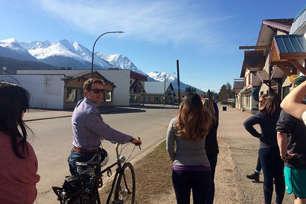 Mayor of Smithers on a bike showing off city.