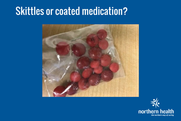 Red coated medication in a bag.