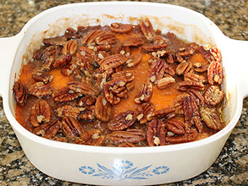 Casserole dish of baked sweet potatoes