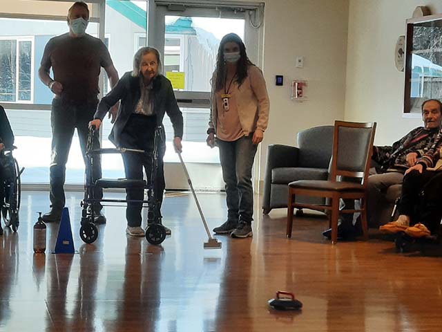 Woman with walker participating in Recreation therapy