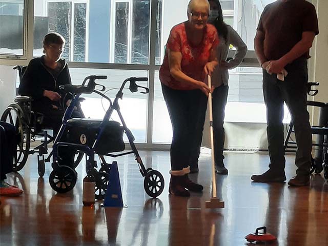 Woman curling in long term care