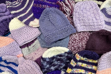 Pile of purple toques