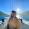 man on boat with mountains