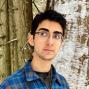 Man with short dark hair and glasses