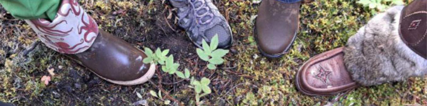 Feet positioned in a circle out in nature.