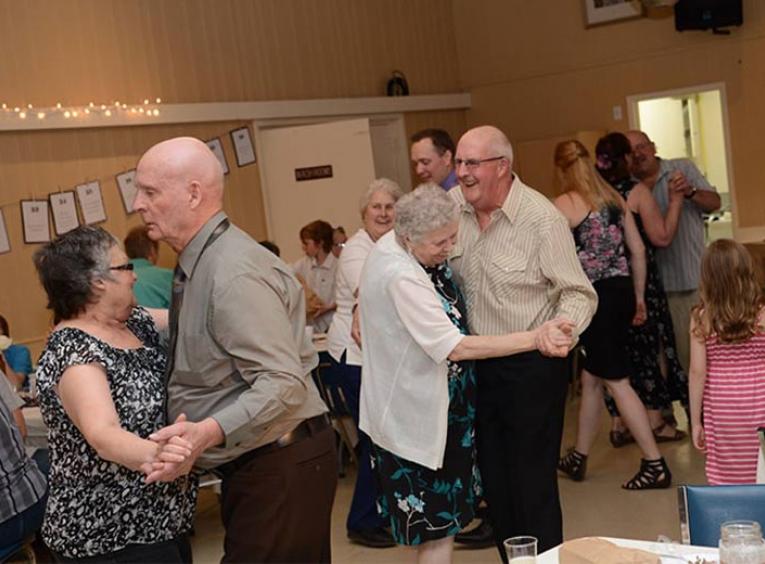 A group of senior's dancing.