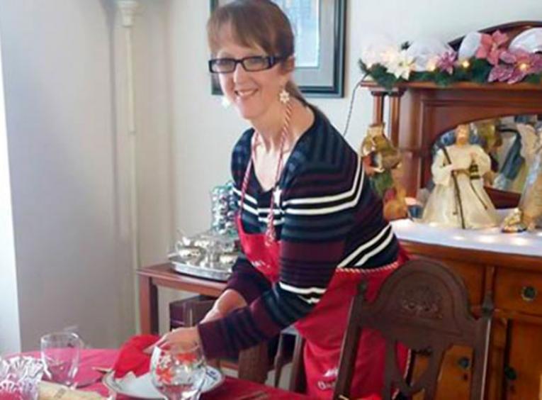 Woman setting a holiday seasons table