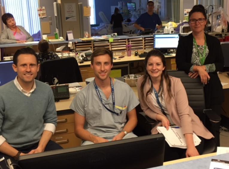 four your ICU care providers posing for a photo in ICU