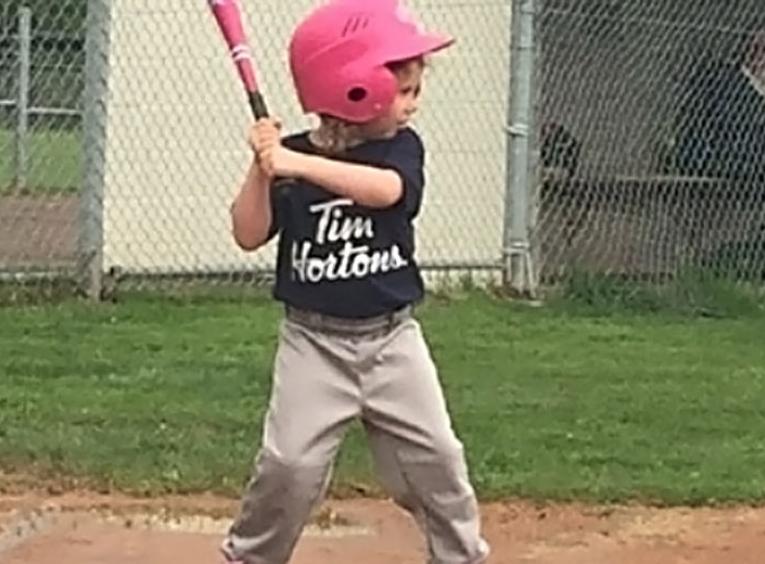 little boy up for bat baseball