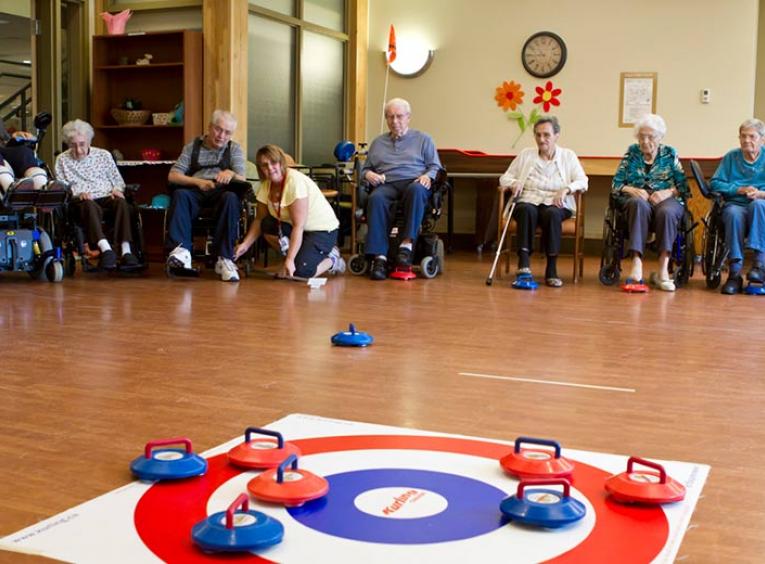 Seniors playing floor curling.