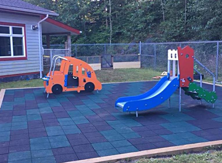 The outdoor play equipment and safety surface at the Discovery Childcare Centre.