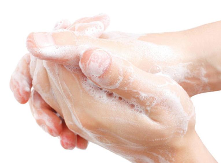 Hands washing with soap.