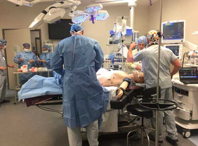 Physician residents in a simulated OR setting.