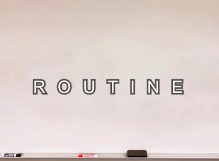 A whiteboard with the word Routine on it.