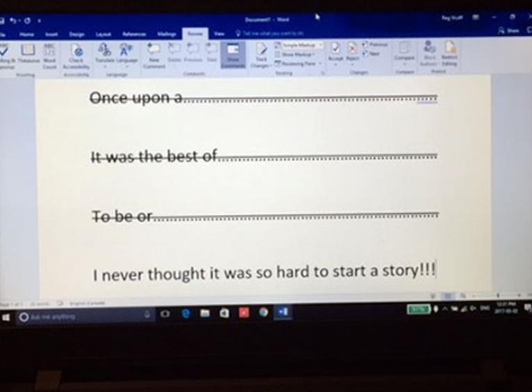Laptop screen with opening story sentences crossed out.