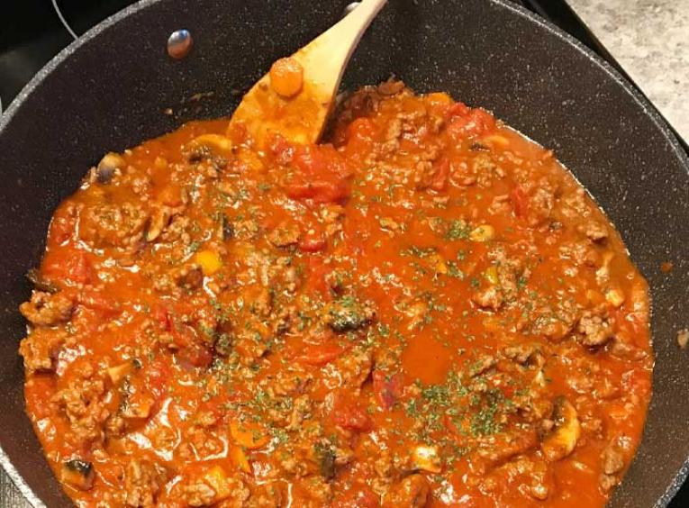 Spaghetti sauce in a pan.