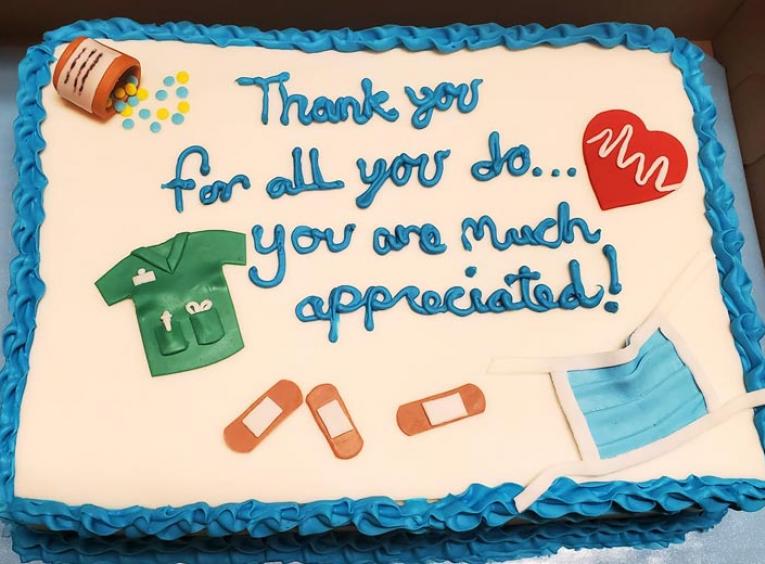 A cake with a message thanking health care providers for their work during COVID-19.