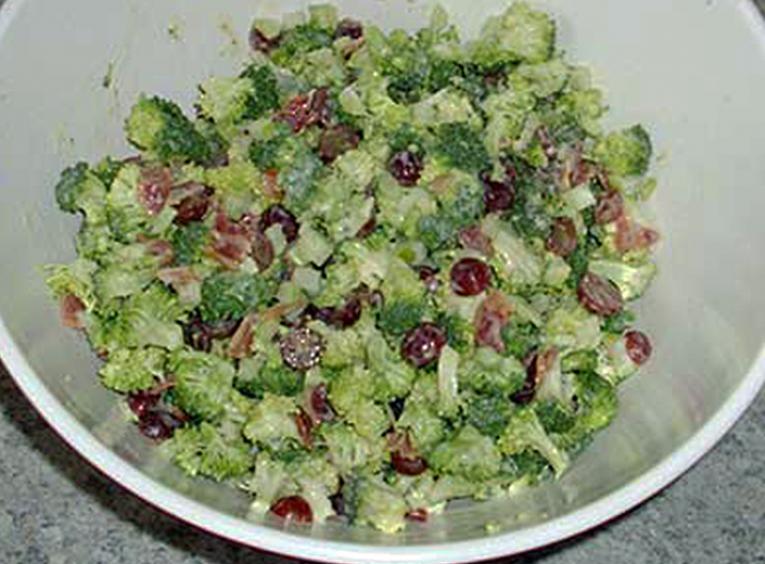 Fresh broccoli salad in a white bowl