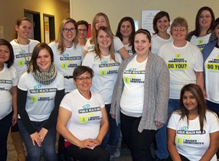 Group photo of Northern Health nurses wearing Immunization Awareness Week t-shirts