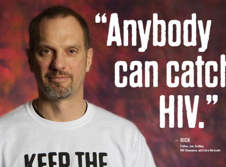Middle aged man standing looking at camera with caption "anybody can catch HIV"