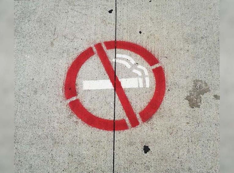 No smoking symbol on pavement.