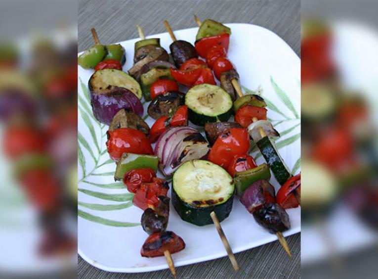 Grilled vegetable skewers with peppers, potatoes, cherry tomatoes, and zucchini
