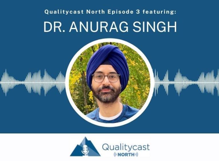 a picture of Dr. Anurag Singh  wearing a blue shirt and turban with green trees in the background