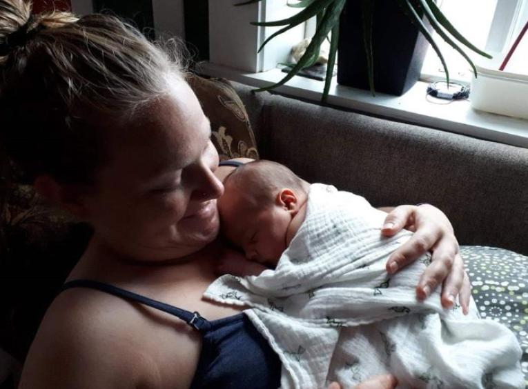 Emma holding Soren on her chest at two days old